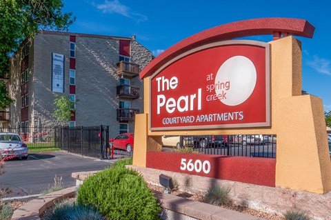 a sign for the pearl hotel and casino in front of a building