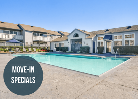 a swimming pool with apartments in the background and a move in specials graphic